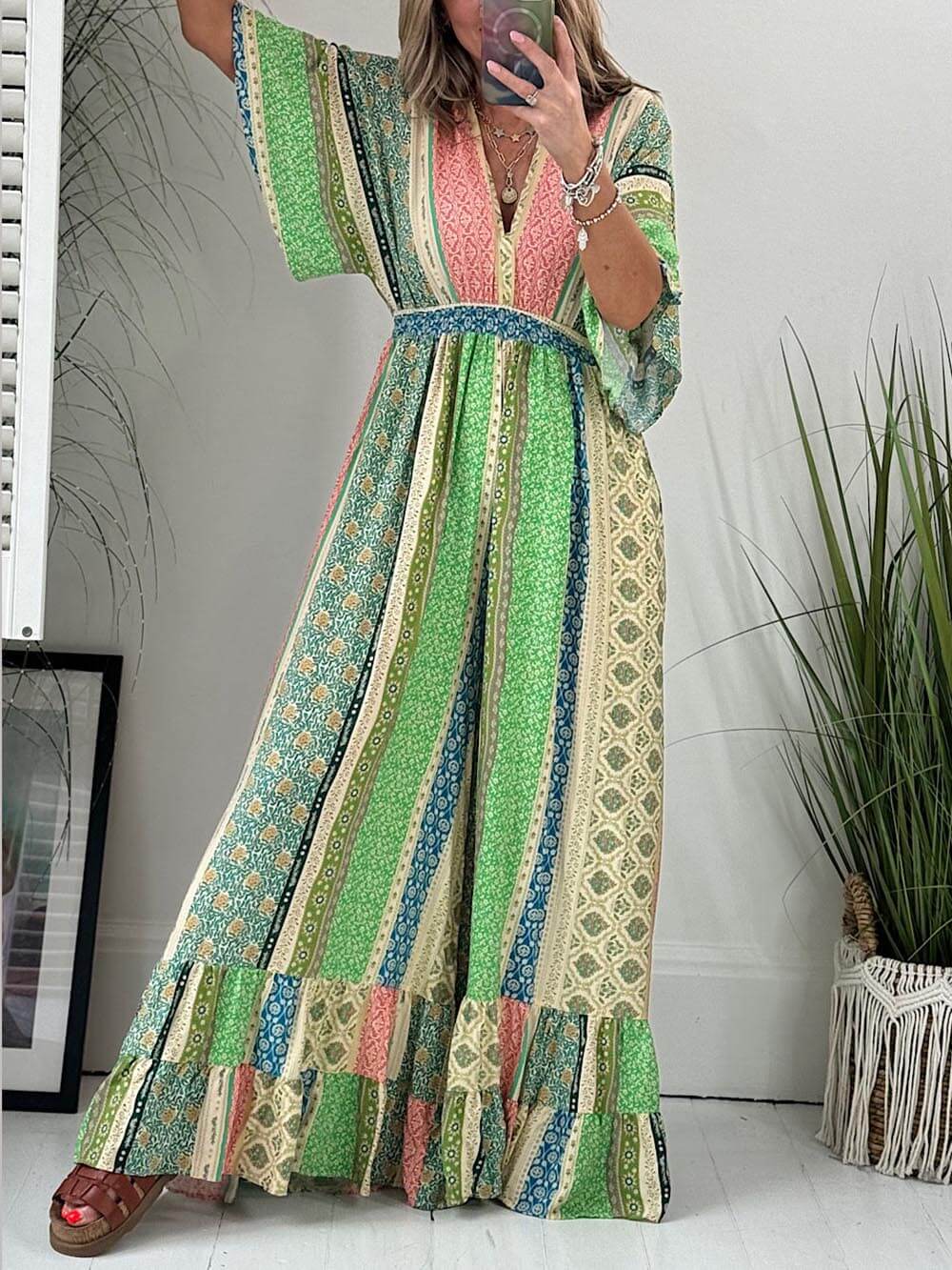 Lauren | Retro gebloemde jumpsuit -Brede mouwen, zakken, wijde broek.