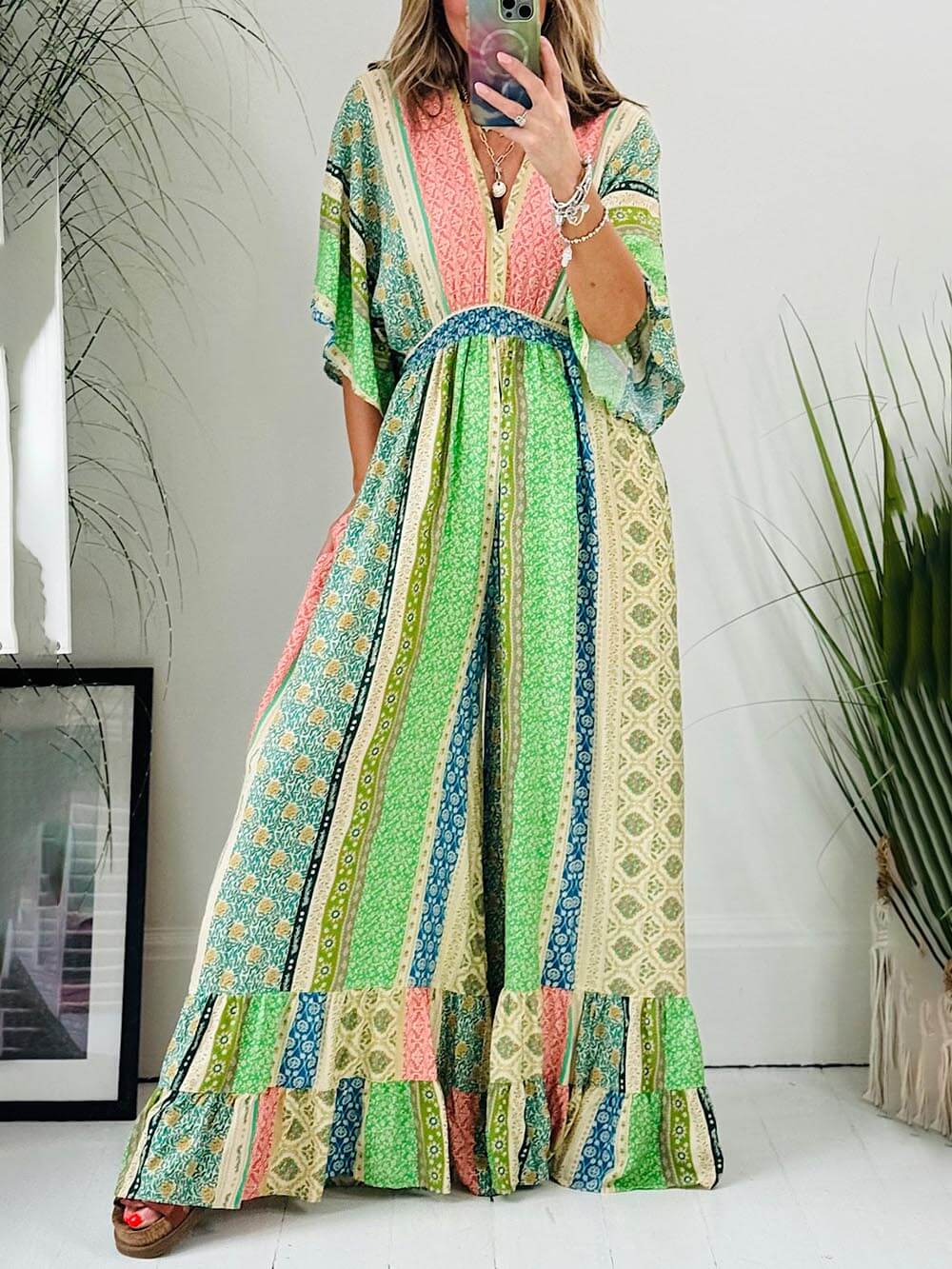 Lauren | Retro gebloemde jumpsuit -Brede mouwen, zakken, wijde broek.